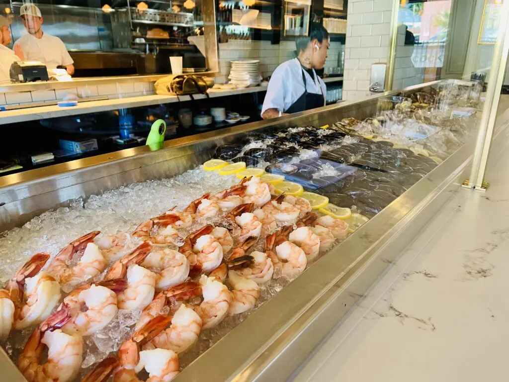 The raw bar at Walloon's is lined with jumbo shrimp, fresh mussels, and East coast oysters. (Photo by Courtney Dabney)