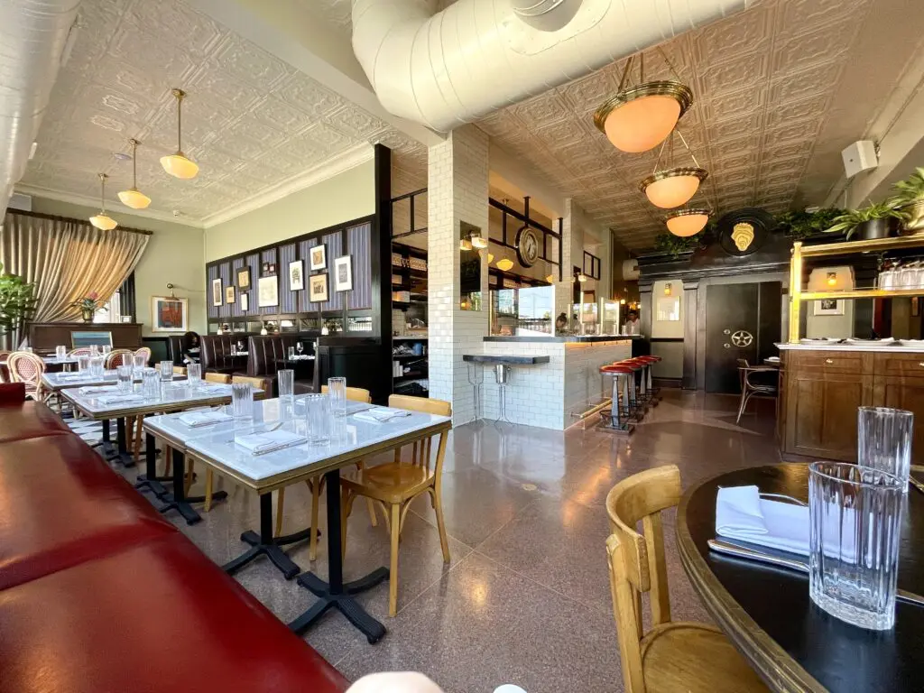 The terrazzo flooring with its inlaid star and the bank vault now topped by an oyster shell. (Photo by Courtney Dabney)