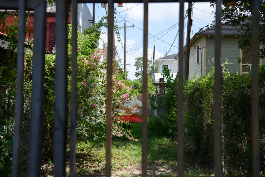 The gate and Humpty Dumpty statue at the mural entrance (Photo by Saranna Zhang/Kevin Zhang Photography)