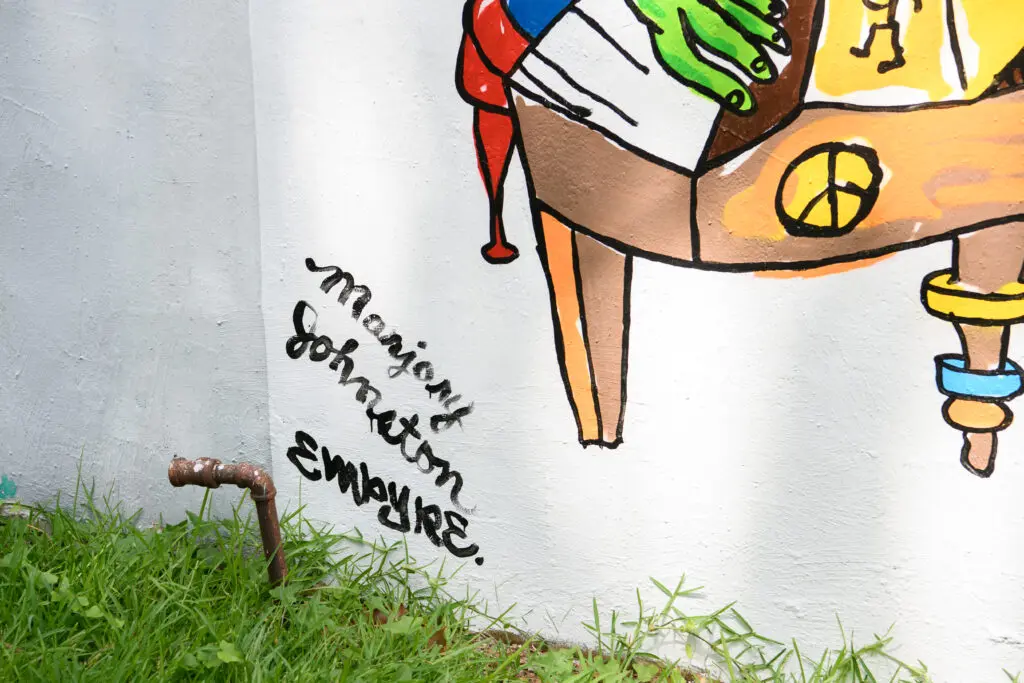 Marjory Johnston and Carlos Alcaraz (Empyre) signatures on the "Don't Be Scared" mural (Photo by Saranna Zhang/Kevin Zhang Photography)