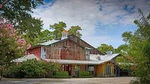 The front of the Dosey Doe barn faces I-45, and is easy to spot on the feeder road.
