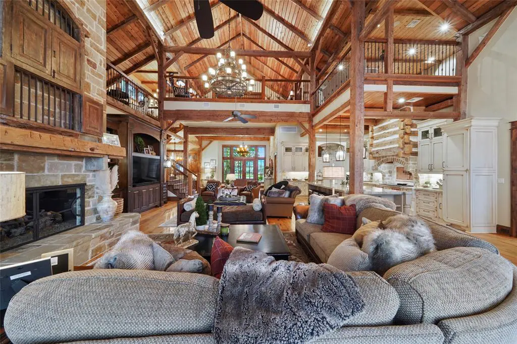 Rough hewn timbers and stone work in the Lake Conroe home at 9144 Escondido Drive in Willis. (Photo by EmoMedia/Compass)