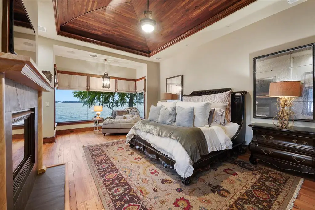 One of two primary suites with lake views at 9144 Escondido Drive on Lake Conroe.  (Photo by EmoMedia/Compass)