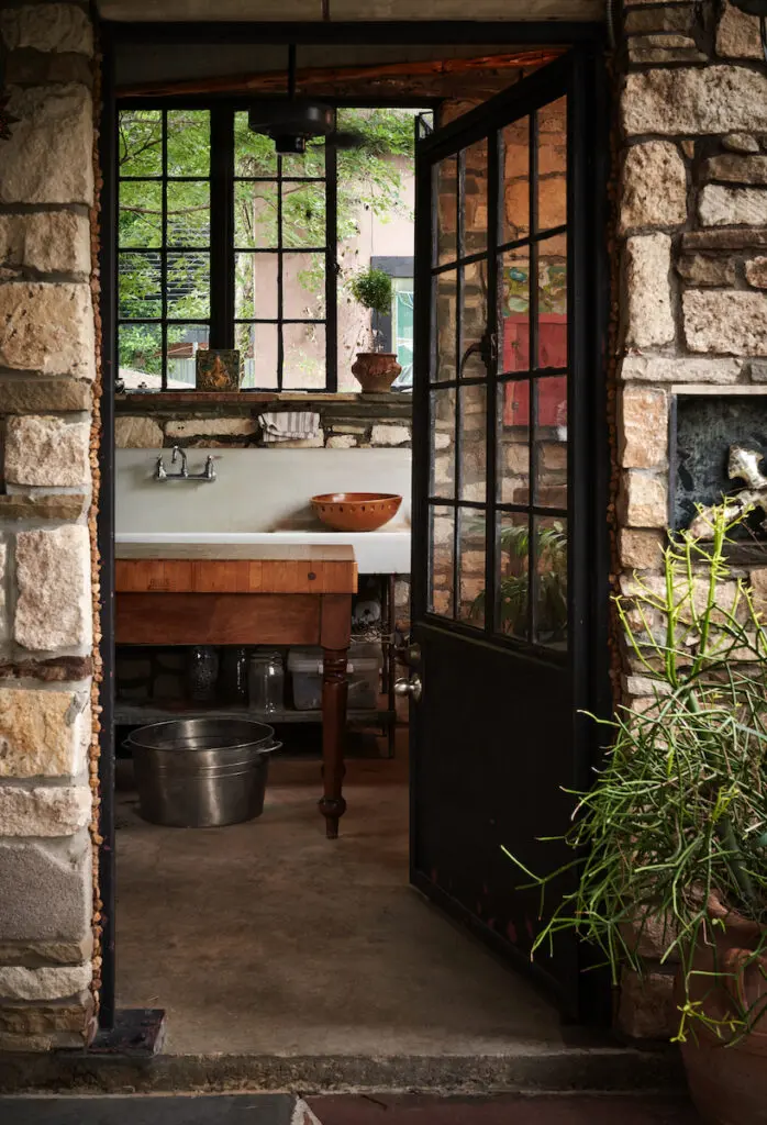 The sink in Robert Bellamy’s former tile studio was salvaged from a 1920s estate on Swiss Avenue. He now uses the room as a bar. (Photo by Pär Bengtsson)