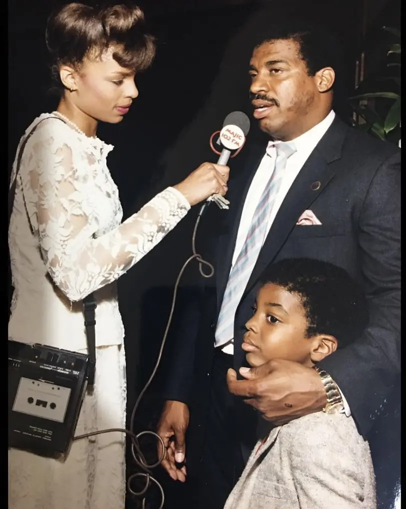 A radio correspondent from Majic 102.1 interviews the late Harris County commissioner El Franco Lee, who is pictured here with his son, artist El Franco Lee II. (Courtesy El Franco Lee II)