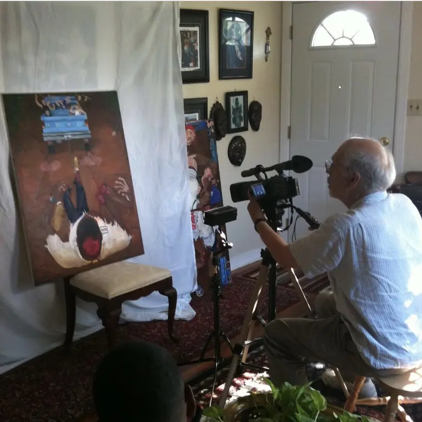 Film director Mike Gray documents artist El Franco Lee II's painting of the James Byrd incident, which occured in 1998. Gray was an Academy Award, Golden Globe and BAFTA-nominated screenwriter who co-wrote "The China Syndrome" (1979), which predicted the Three Mile Incident, a nuclear meltdown which occurred on March 28, 1979. Gray had planned to make a documentary about El Franco Lee II's uncle Bob Lee. (Courtesy El Franco Lee II)