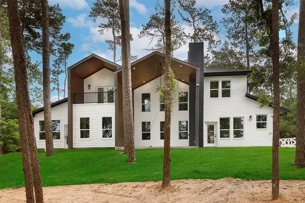 The wooded lot at 2008 Carriage Run allows for a secluded backyard, which can be admired from the upper balcony.