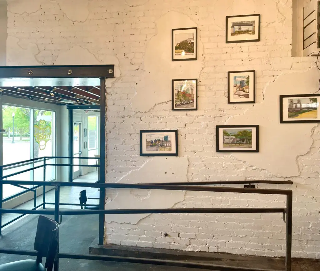 Eazy Monkey with architectural renderings by Andrew Dilda's father-in-law. (Photo by Courtney Dabney)