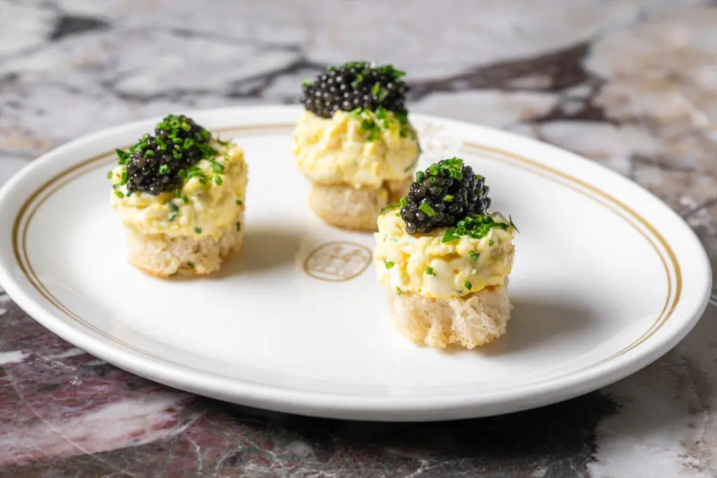 The egg salad sandwiches with caviar at Mister Charles. (Photo by Evan Sung)