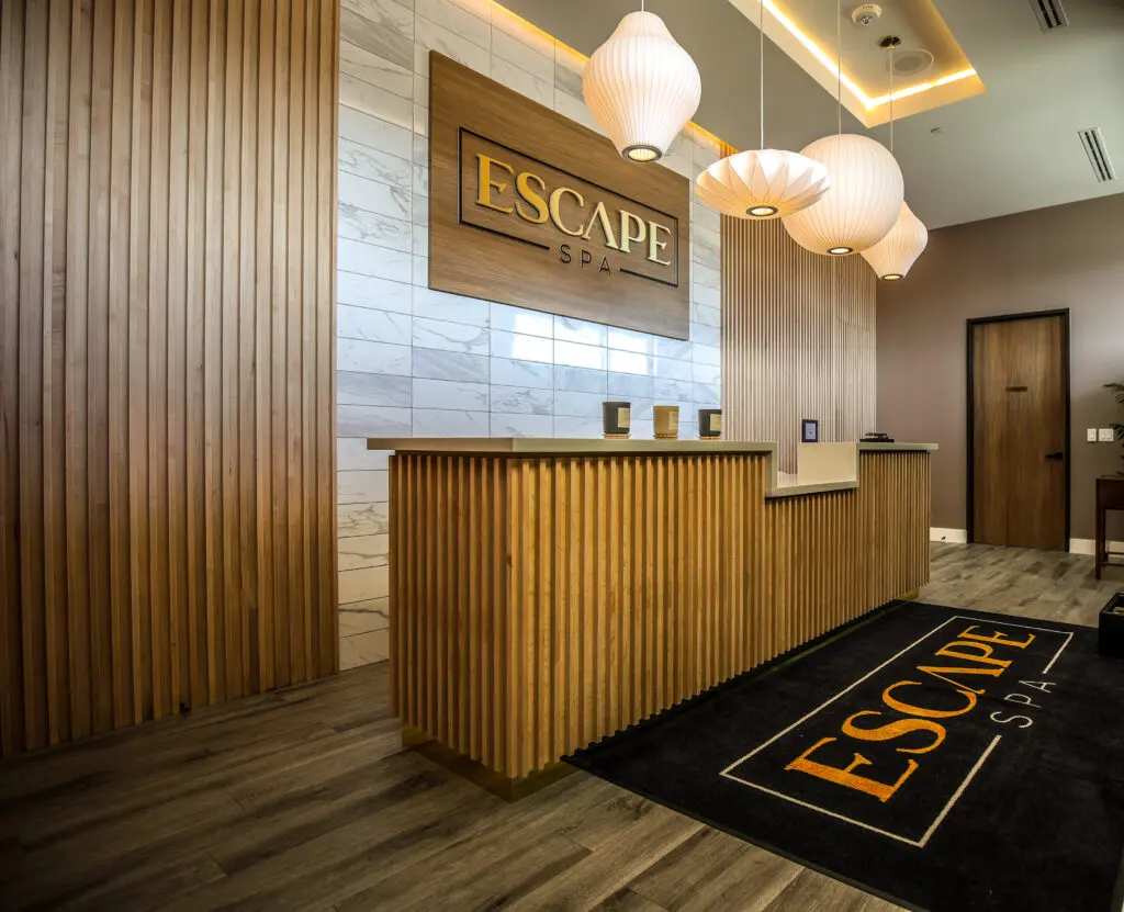 Inside the new Escape Spa. The holistic approach to wellness here includes resort-style amenities such as the complimentary coed wet room. There, guests can soak and unwind those tense muscles in a bubbling 12-person hot tub or step into the eucalyptus-scented steam-filled dry sauna. (Photo by Courtesy of Escape Spa)