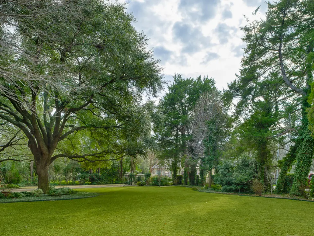 A swath of green lawn ready to be landscaped at the 2023 Kips Bay Decorator Show House.