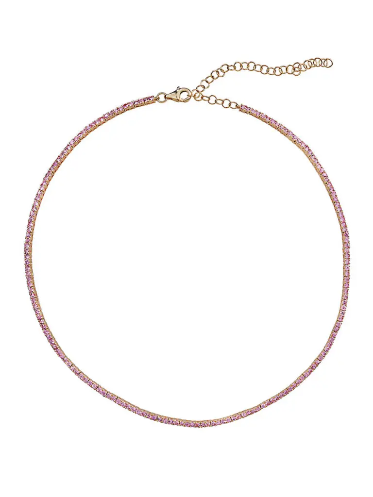 This pink sapphire tennis necklace by Lee Jones is artfully crafted from 14-karat yellow gold, lavishly adorned with 4.89 carats of glimmering pink sapphires.