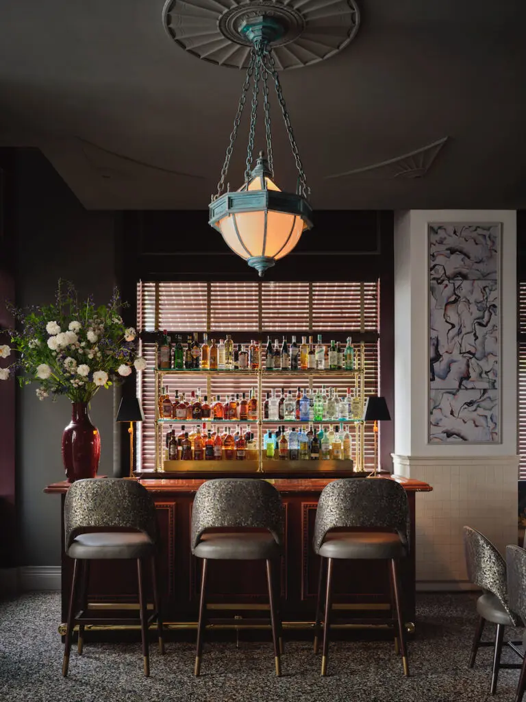 A bar in the moodier portion of Mister Charles.  (Photo by Douglas Friedman)