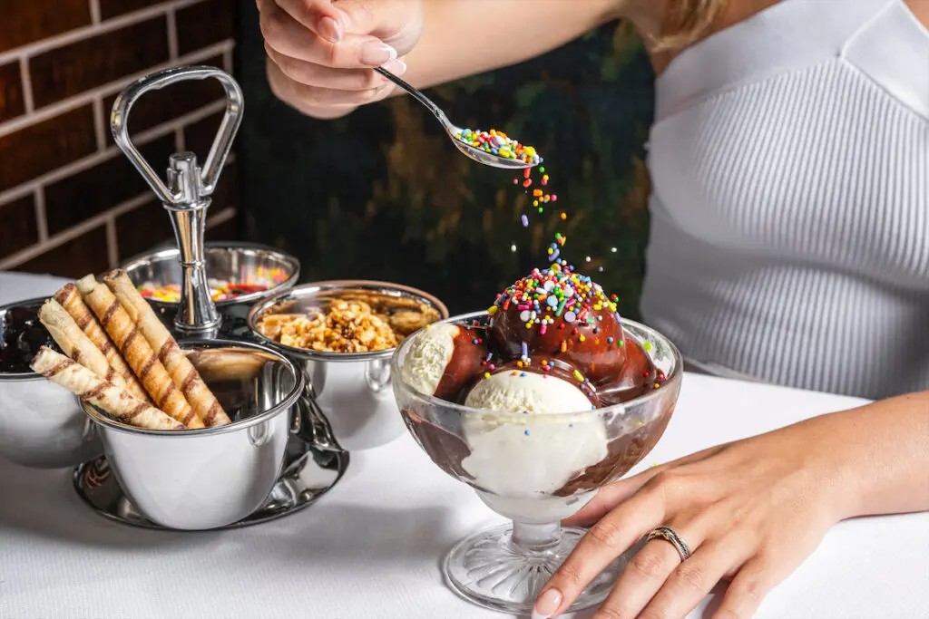Melissa Smrekar, however, cannot resist The Soda Foundation Sundae, Mister Charles’ homage to the cherished Highland Park Soda Fountain. (Photo by Evan Sung)