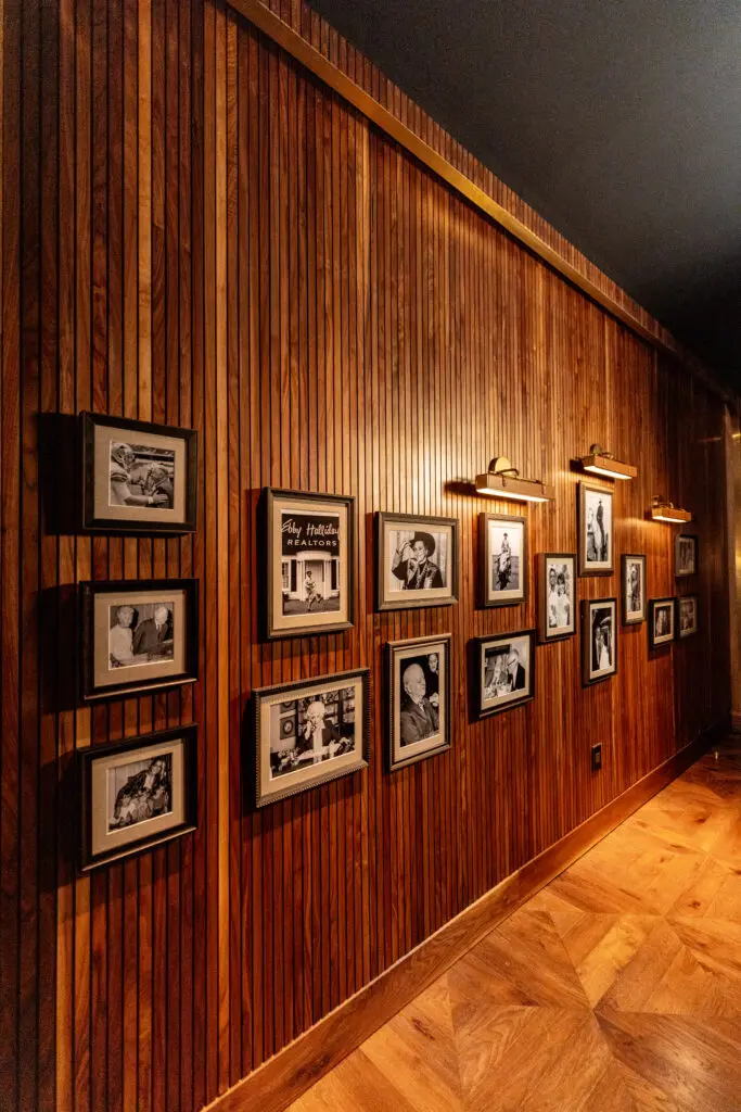 The entrance of Stillwell's is filled with Barbier-Mueller family photos. (Photo by Kathy Tran)