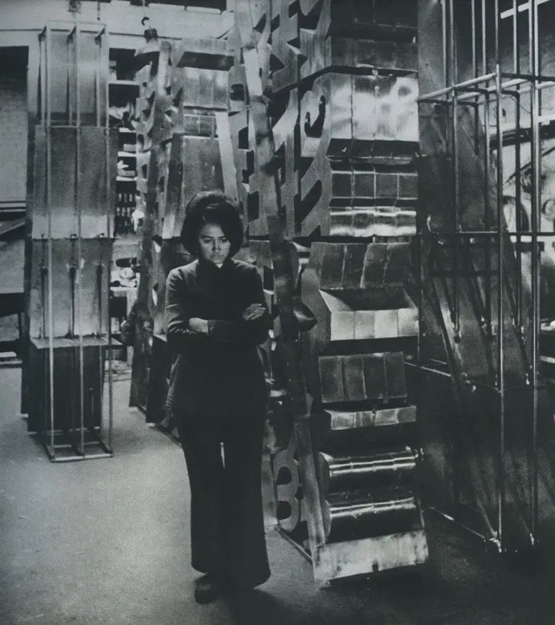 Chryssa appears in her Brooklyn studio with one of her most important neon artworks "The Gates to Times Square," 1964-1966. (Photo by Howard Harrison. Courtesy © The estate of Chryssa Vardea and Tate Modern)