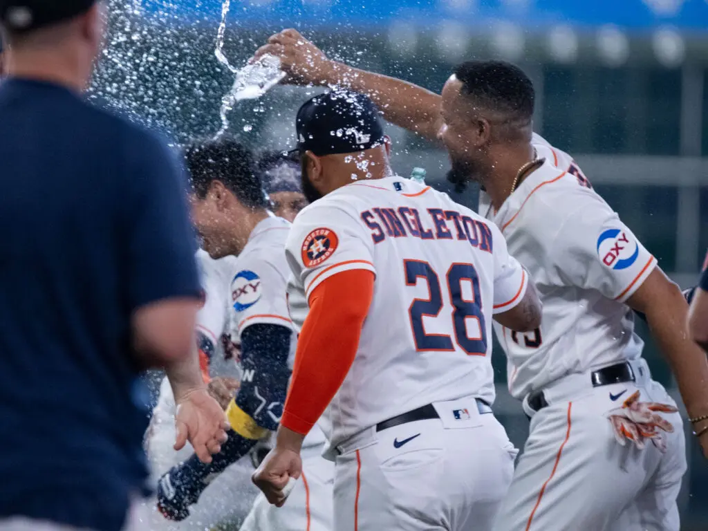 Jose Abreu, a 10 year MLB veteran and former MVP, cannot wait to douse walkoff man Mauricio Dubon with water earlier this season.  (Photo by F. Carter Smith) 