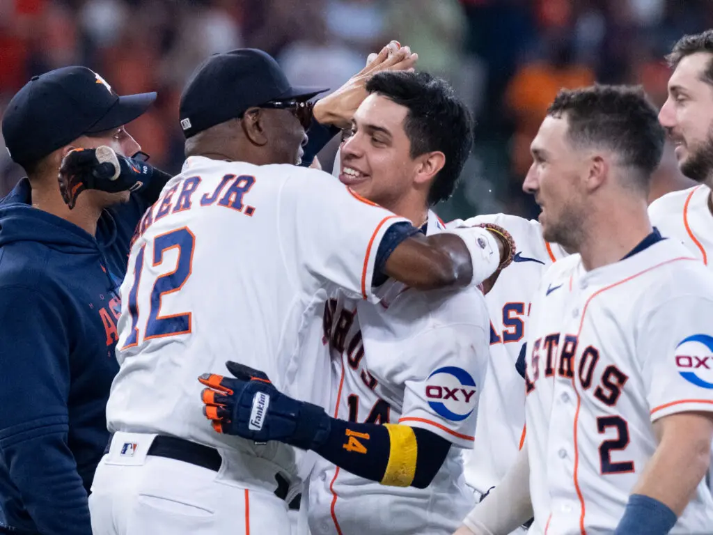 Astros manager Dusty Baker wrapped Mauricio Dubon in a major hug more than once this season. (Photo by F. Carter Smith)