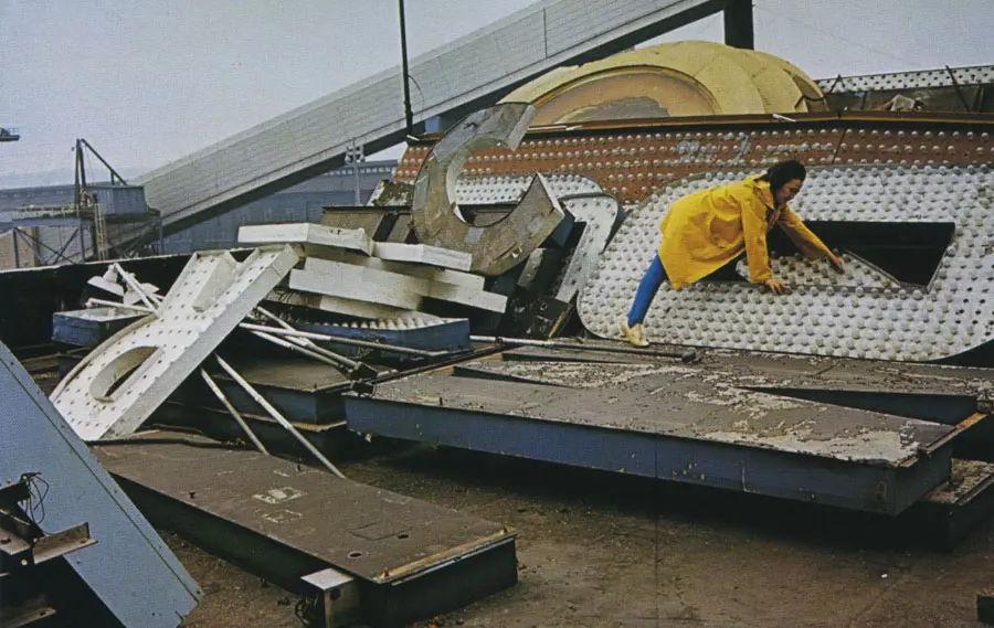Pioneering neon artist Chryssa inspects vintage signage in 1965. (Photo by Adelaide de Menil. Courtesy Rock Foundation)