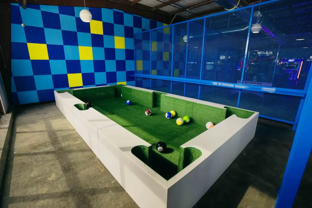 The new fun at Cidercade Arlington includes foot billiards.