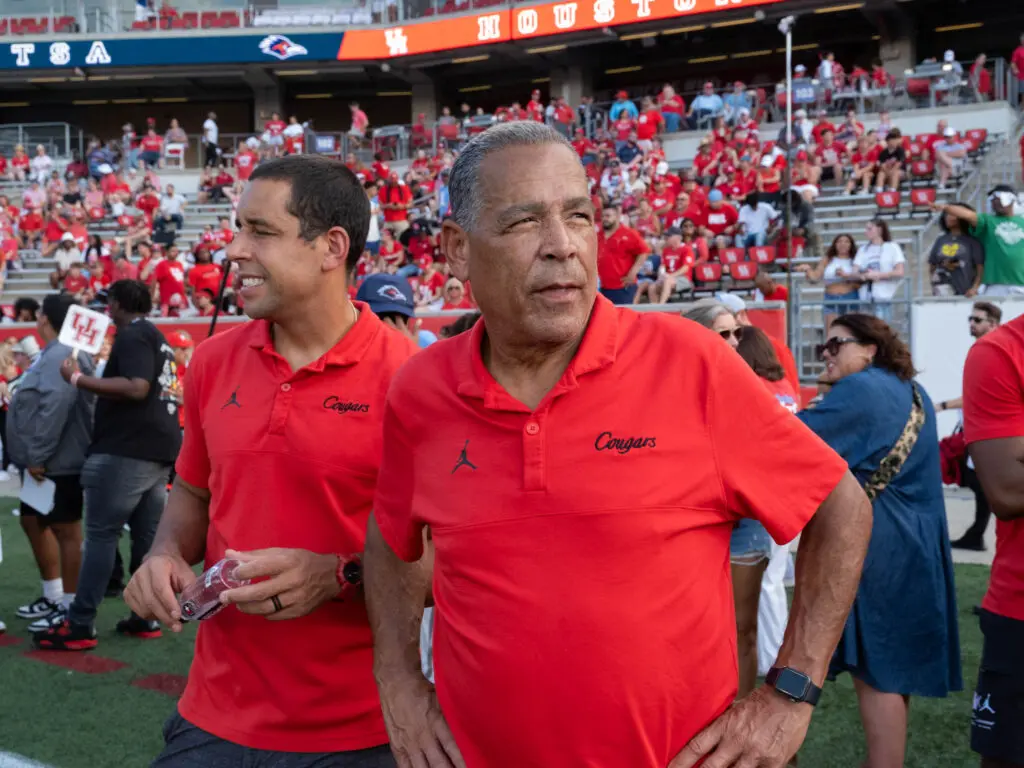 University of Houston basketball coaches Kellen Sampson and Kelvin Sampson come out for football games and other UH sports. (Photo by F. Carter Smith)