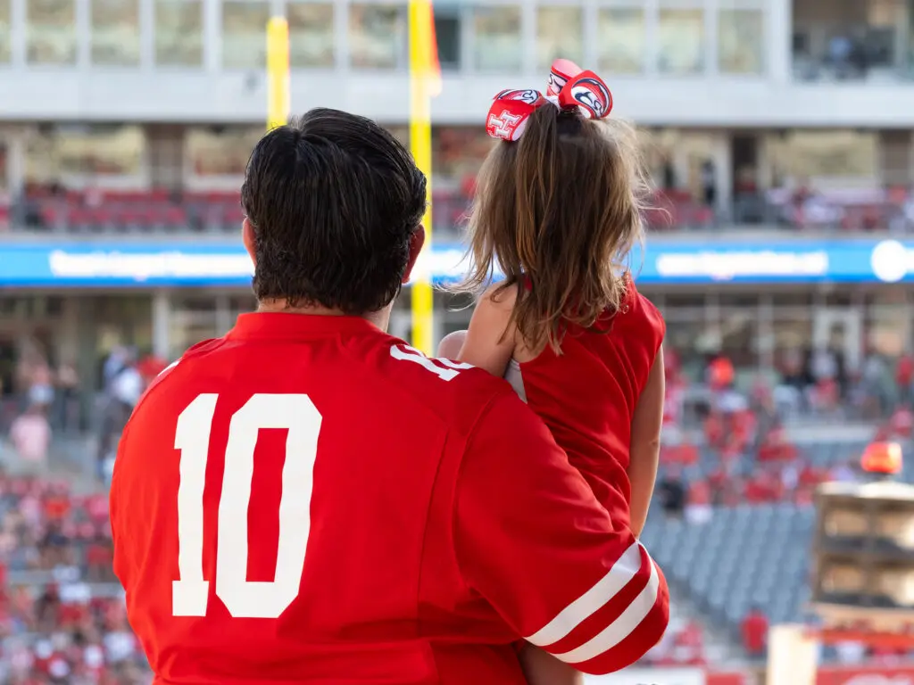 Being a University of Houston football fan can start young. And run in the family. (Photo by F. Carter Smith)