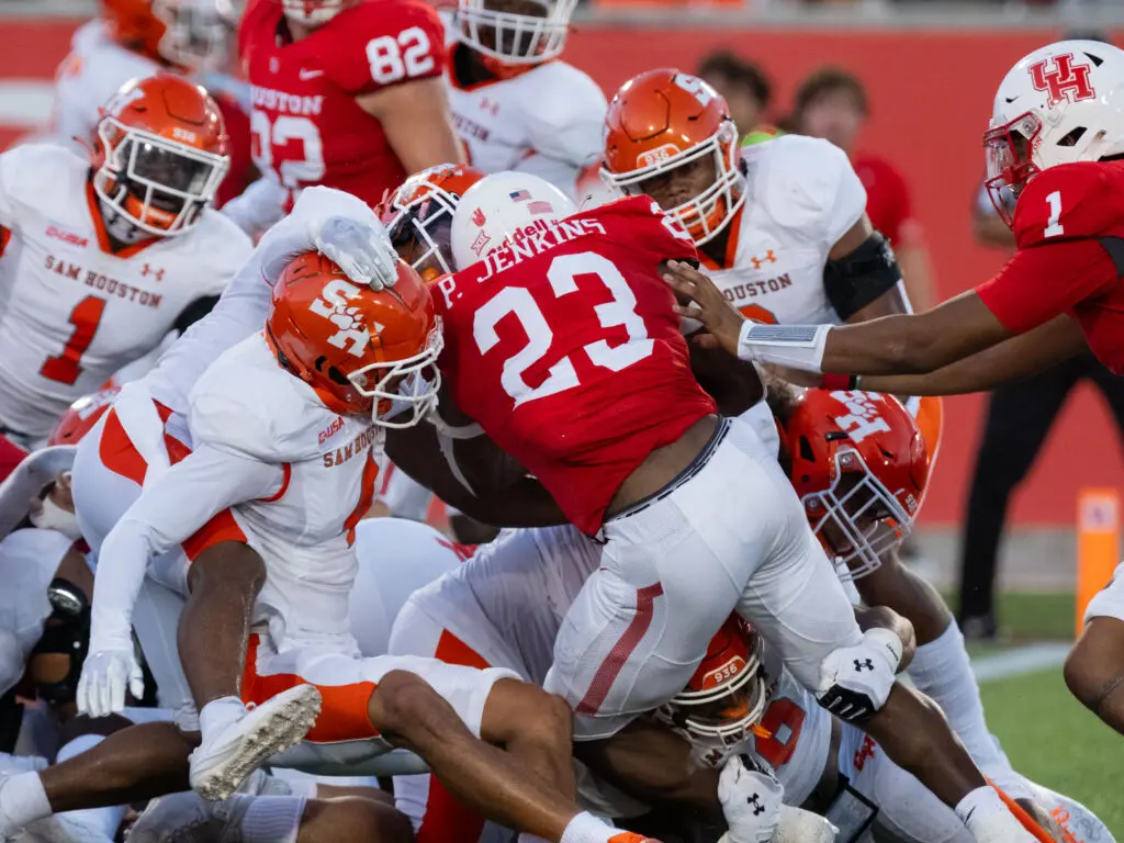 University of Houston freshman running back Parker Jenkins sometimes seemed to be taking on the entire Sam Houston team. And winning. (Photo by F. Carter Smith)