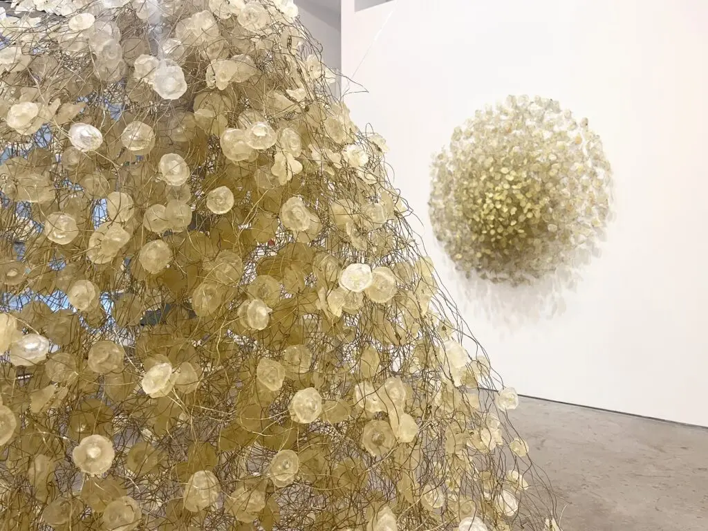 From left: Yuriko Yamaguchi's "Web," 2007, and "Infinite Growth," 2009. Both sculptures are made of hand cast resin and brass wire. (Courtesy Barbara Davis Gallery)