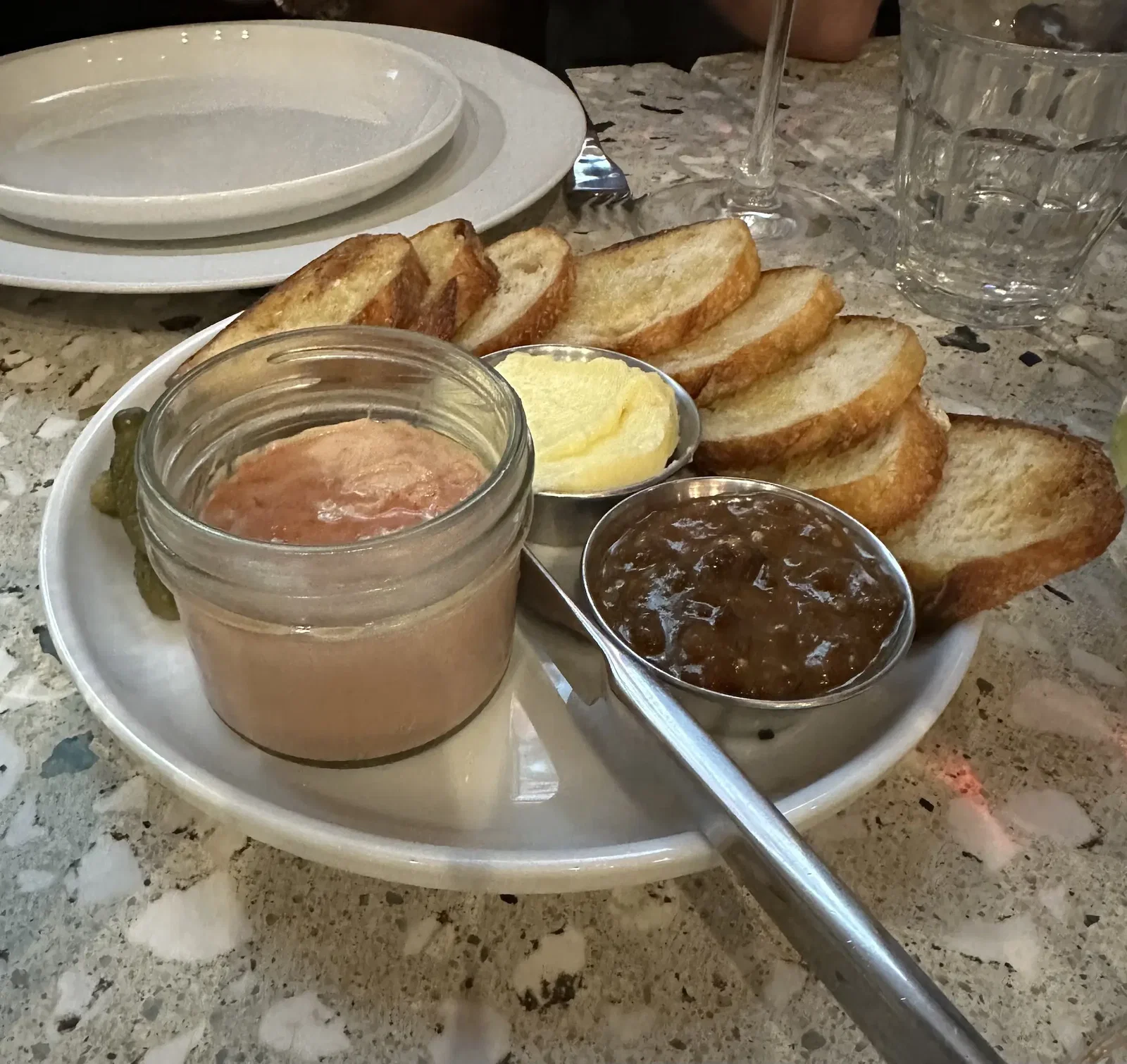 Chef and owner Kat Turner is behind the food at Highly Likely, including this silky and rich chicken liver mousse and prune mostarda and, below, roasted chicken.