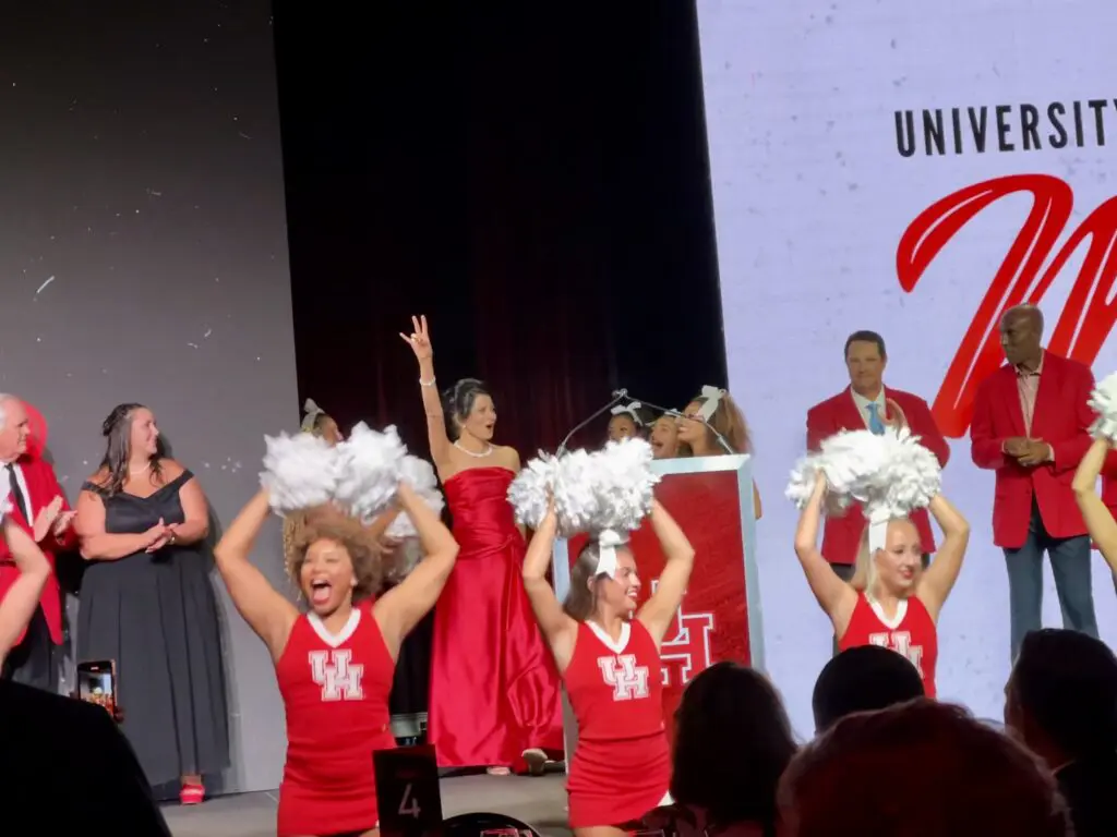 UH president Renu Khator got into the spirit of the Hall of Honor night. (Photo by Eddy Matchette/Courtesy UH Athletics)