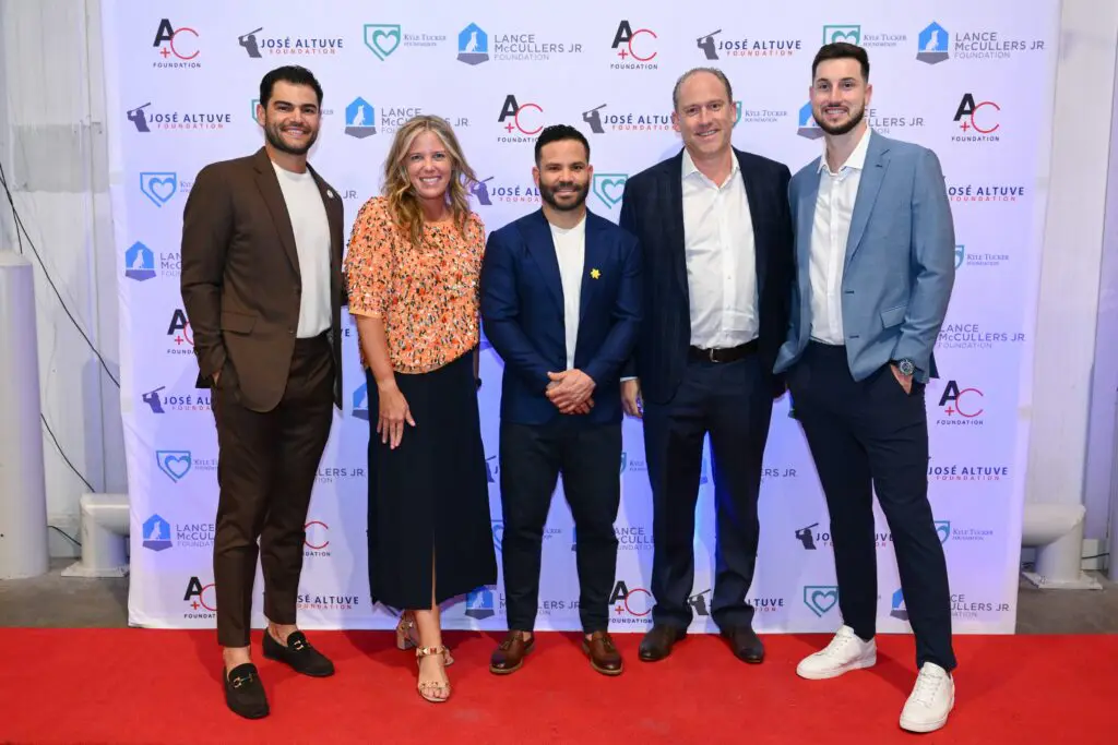 Melissa & Dan Sugulas get a thrill being photographed with Lance McCullers, Jose Altuve, and Kyle Tucker. (Photo by Michelle Watson)