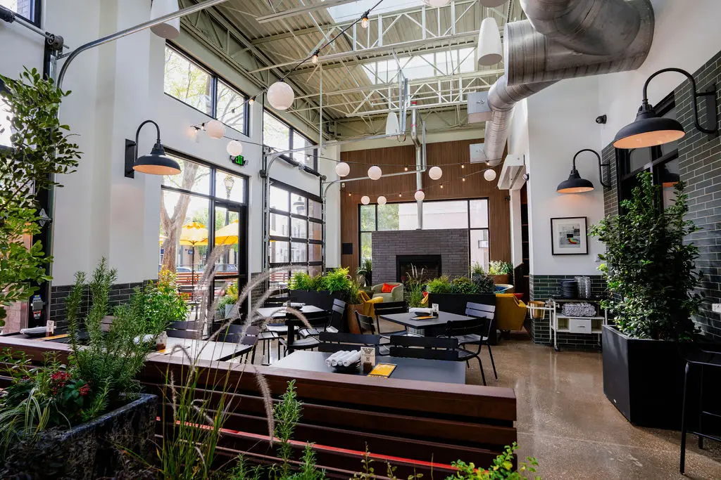 You'll find open air ease and plenty of greenery inside the new Postino. (Photo by Susie Burleson)