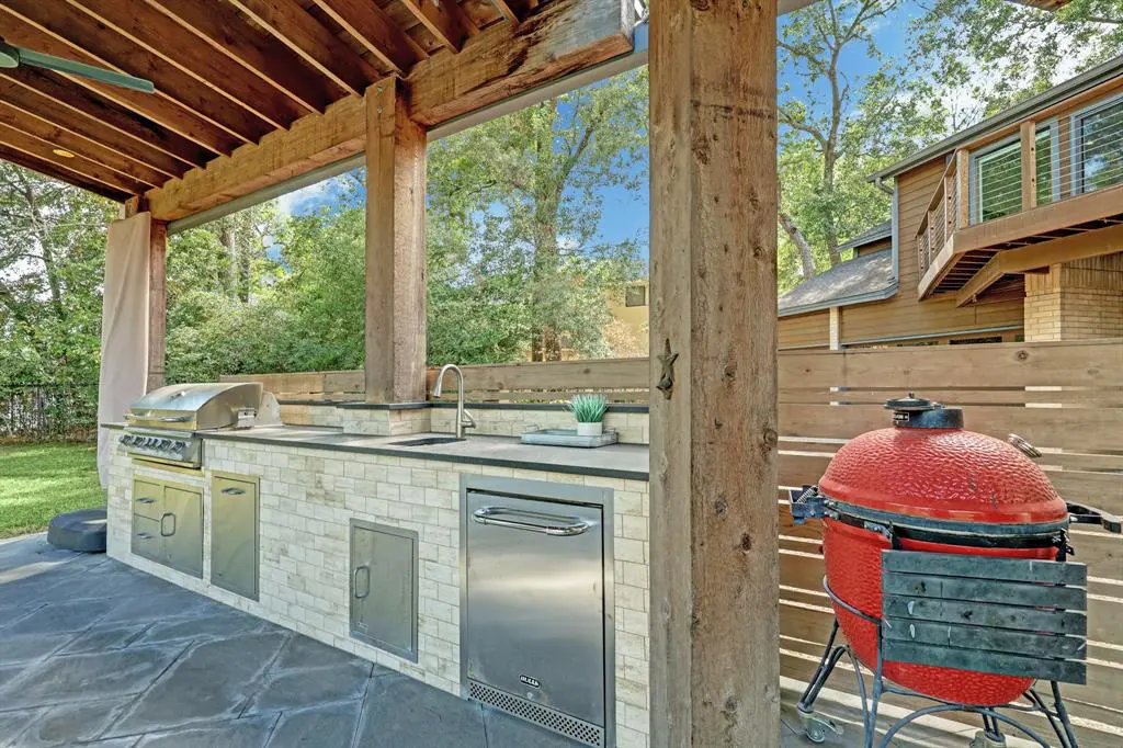 The covered outdoor kitchen is another of the property's perks. (Photo by TK Images)