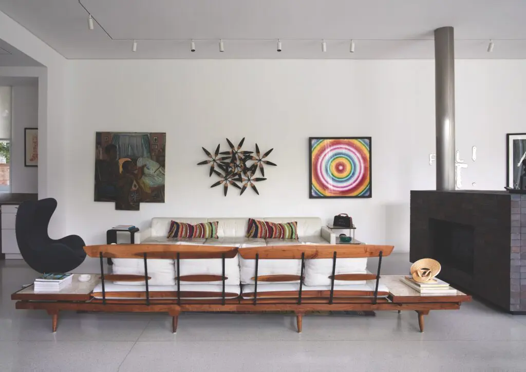 Mid-century Phillip Lloyd Powell sofa bench. Vintage Arne Jacobsen Egg chair. Inga Kimberly Brown painting, James Surls wall sculpture. Rob & Nick Carter work on aluminum. On side table, Pro Choice handbag by Michele Pred. (Photo by Pär Bengtsson)