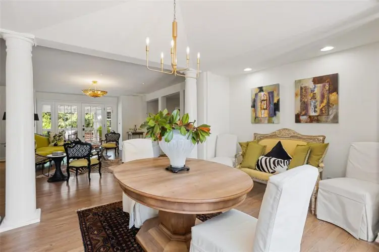 Unbelievable flow from the dining, through to the den, patio and kitchen beyond.