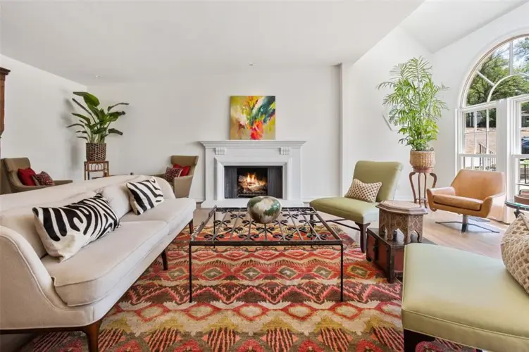 412 Hazelwood's arched windows add to the drama of the cozy formal living room.