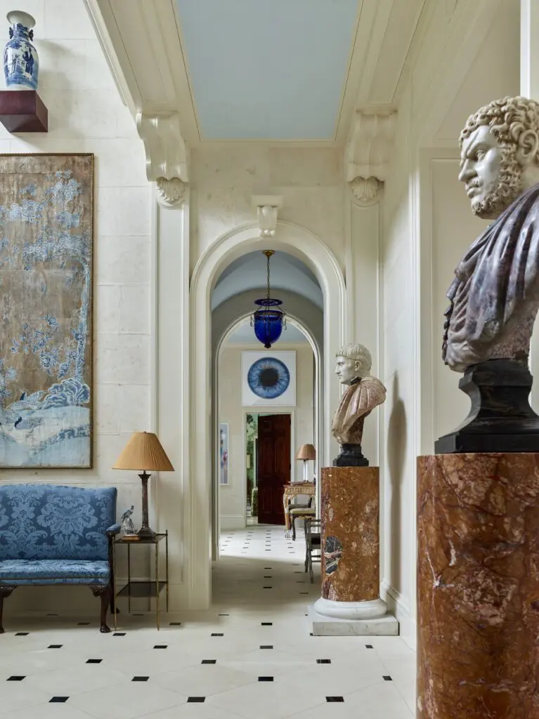 An enfilade of arches connects the entry hall and stair hall in an Arts and Crafts-style home in Ohio designed by Peter Pennoyer. (Photo by Eric Piasecki)