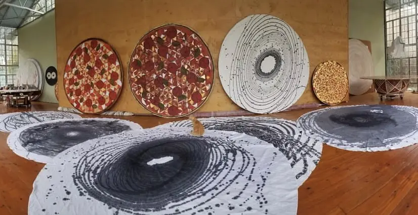 Pictured here are early versions of round paintings featured in artist Nestor Topchy's exhibit "Stuffthemouthofheavenwithallyoukanteat," which remains on view at the Josh Pazda Hiram Butler Gallery through Saturday October 28, 2023. (Courtesy Nestor Topchy)