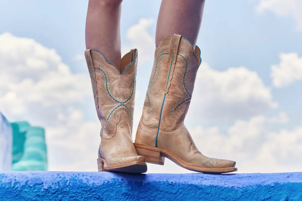 A Lucchese Tilly cowboy boot in pearl bone is made of soft goat skin.