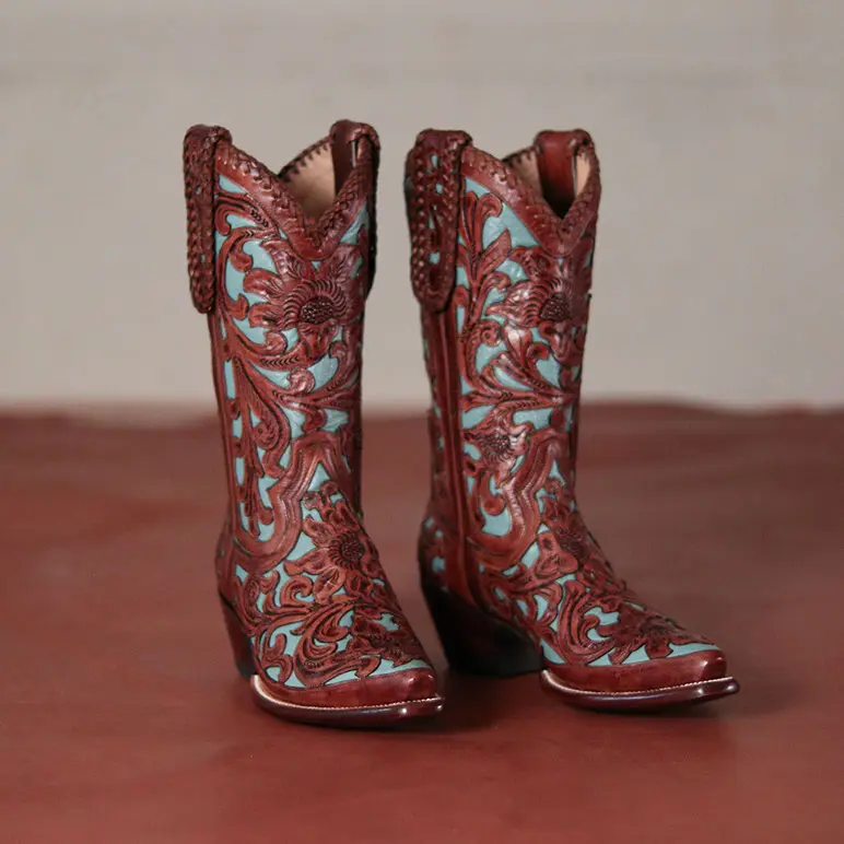 Custom Turquoise filigree in hand-cut leather from the Vaquero collection at M. L. Leddy's.