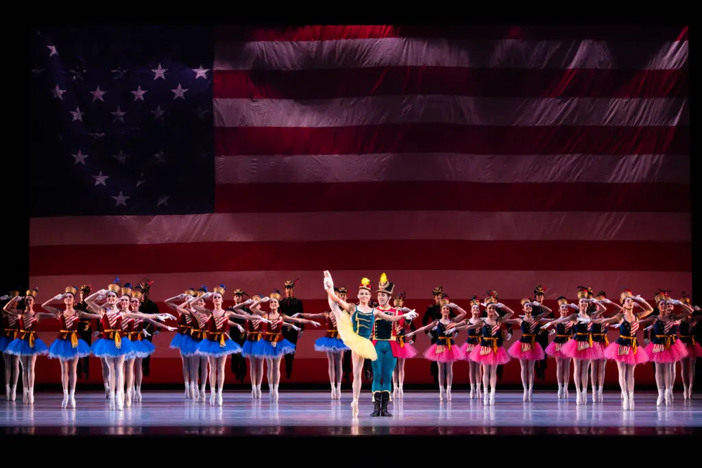 Houston Ballet first soloist Tyler Donatelli and principal Connor Walsh with artists of Houston Ballet in "Stars and Stripes."
Choreography by George Balanchine, © The George Balanchine Trust. 
(Photo by Lawrence Elizabeth Knox. Courtesy Houston Ballet)