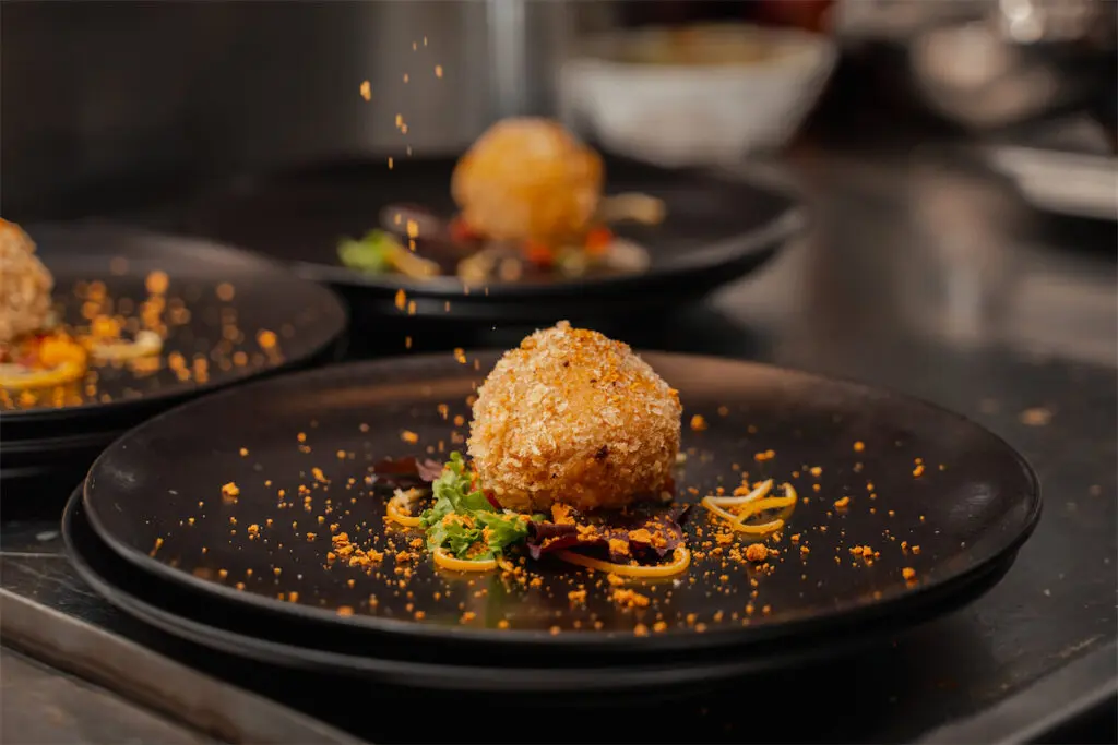 Onboard amenities include delicious cuisine.