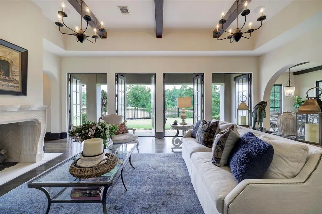 The family space is bright and inviting, with French doors leading outside into the backyard. 