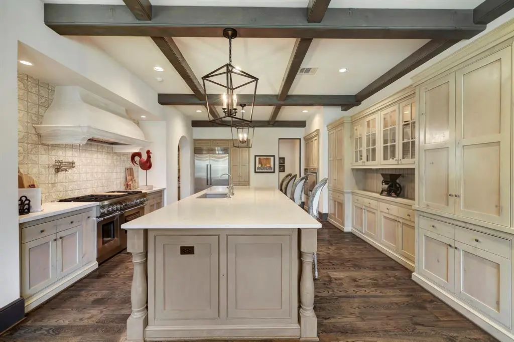 The kitchen is located off the family room. 