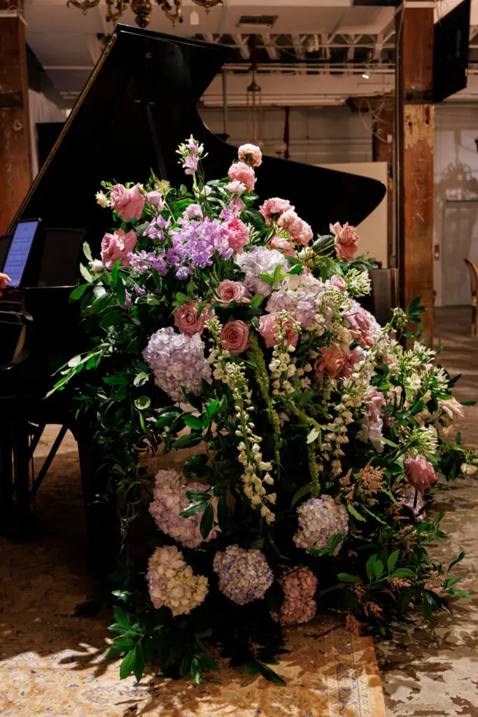 Massive arrangements by Sara Perez Ekianger of Antigua Florals accented the elegance of the Versailles-inspired evening at NOAG.