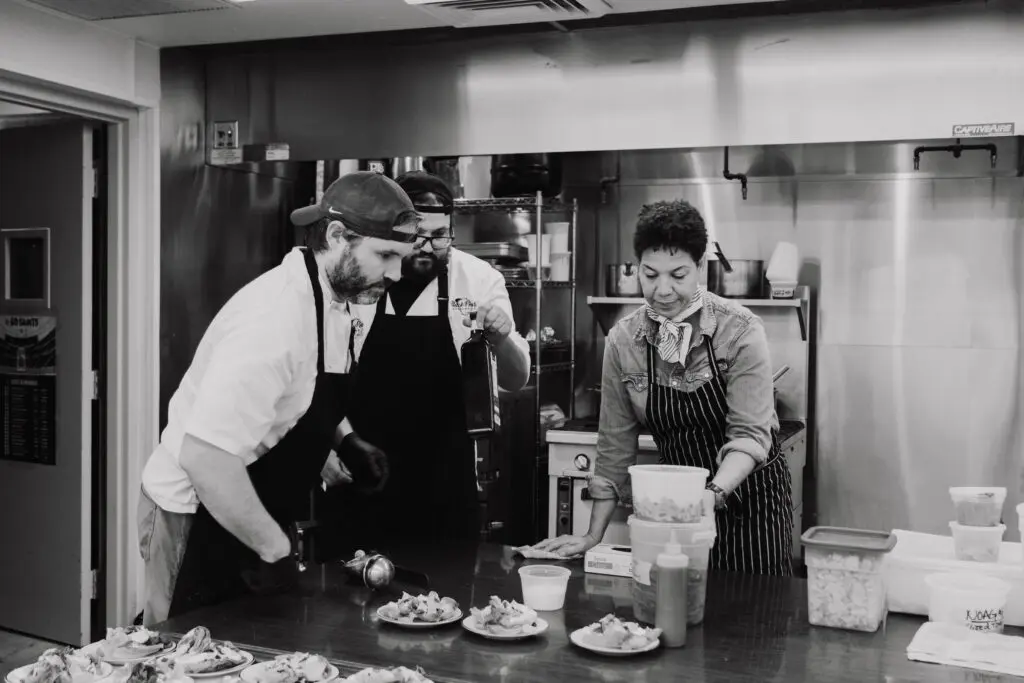 James Beard Award winning chef Nina Compton working in the kitchen on the French dinner at NOAG.  (Photo by MoDavisPhotography.com)