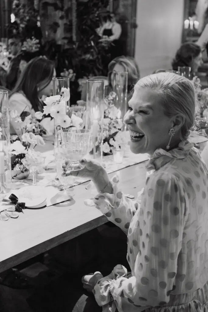 Bettina Bennett of Princeton, New Jersey,  raises a glass during the Versailles-inspired dinner at New Orleans Auction Galleries.