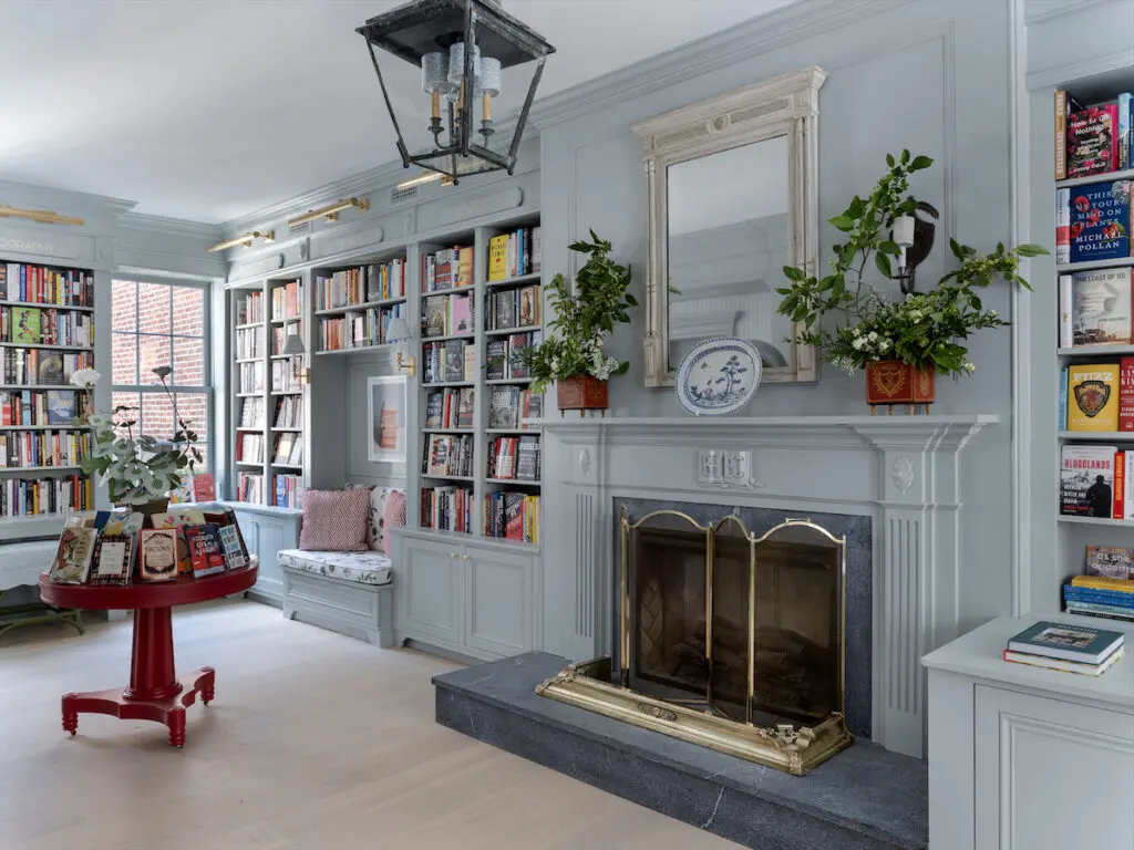 The shelves of Beacon Hill Books & Café are lacquered in a Farrow & Ball Light Blue. (Photo by Sarah Winchester)