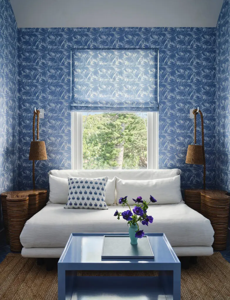 The carriage house’s wallcovering is custom by Meg Braff Designs. Ligne Roset sofa bed, Giorgetti side tables, Palecek lights. (Photo by Douglas Friedman)