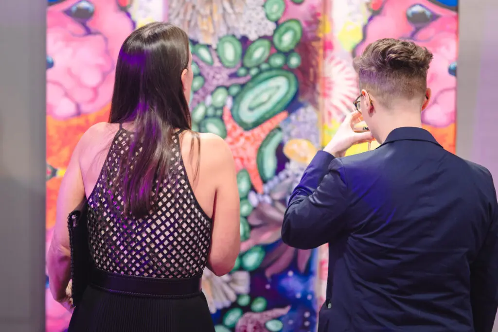 Guests admire the artwork on display at Houston Arts Alliance's Add On Art Gala  (Photo by Johnny Than)